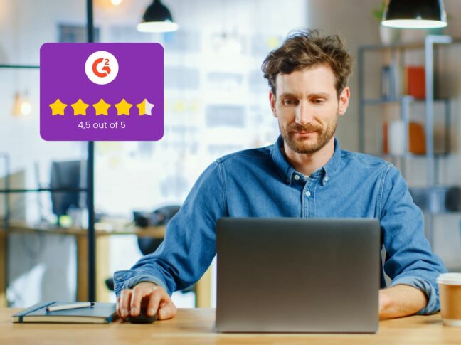 Man is rating the app he is satisfied with on a laptop with a G2 rating of 4.5 out of 5 stars
